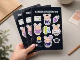 Custom vinyl sticker sheets with graduation theme held in hand showing print quality - Sticker Sheet Printing